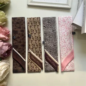 Detail view of French retro coffee bean silk ribbons with 100% polyester washing labels