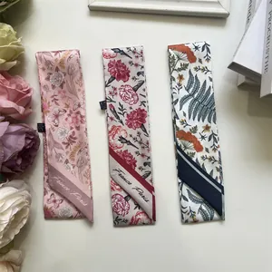 Detail of floral skinny scarves with France Paris print on 100% polyester fabric