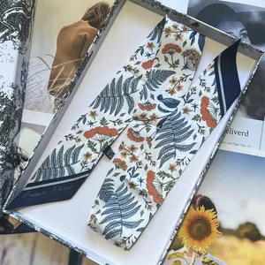 Floral print narrow silk scarf with blue fern and orange flowers in a gift box