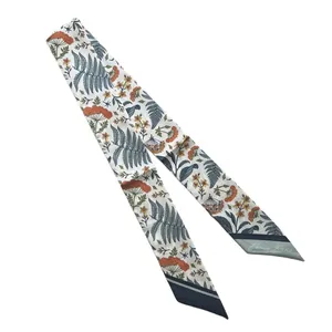 Narrow floral silk scarf with green fern prints and France Paris text on white background