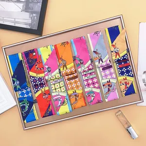 Collection of decorative twilly silk scarves with classic carriage and horse patterns