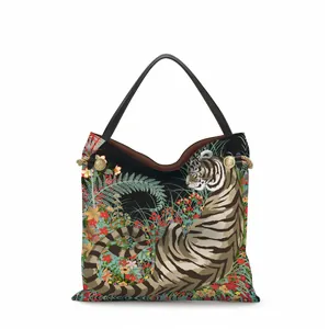Detailed close-up of tiger forest illustration and golden lion rivet on canvas tote bag