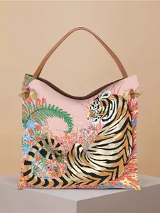 Pink tote bag with tiger and floral illustration, featuring brown leather handles