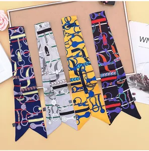 Detail view of twilly silk scarves featuring equestrian print for handbag handles