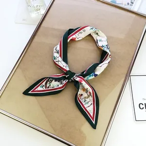 Elegant floral and bird print silk scarf twilly in dark green with red accents