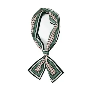 Polka dot and stripe silk-feel neck scarf tied in a bow on a white background