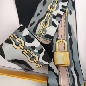 Narrow silk scarf with vintage gold chain and animal print for handbag decoration
