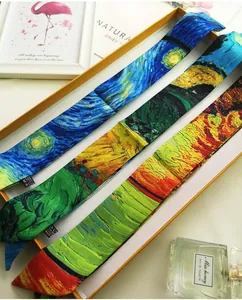 Macro shot of Van Gogh oil painting style skinny silk scarves in a premium gift box