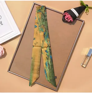 Detail of silk scarf with Chinese crane painting tied on display board
