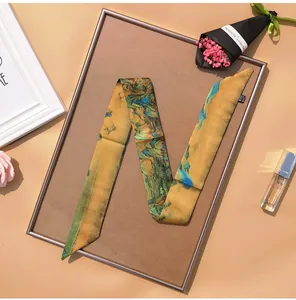 Close-up of artistic crane landscape print silk scarf on decorative frame