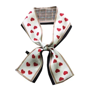 Fashionable twilly scarf featuring red hearts and vintage plaid pattern on cream silk fabric