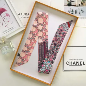 Floral pink faux silk twilly scarf neatly folded in an elegant gift box set