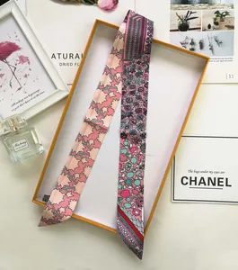 Detail of floral silk twilly scarf for handbag handle with luxury gift box packaging