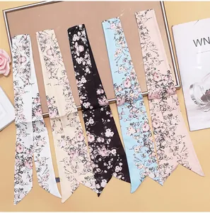 Detailed set of five narrow satin scarves with floral cherry blossom prints in varied colors
