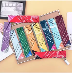 Close-up of colorful paisley narrow scarves tied on handles and used as headbands