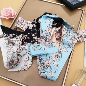 Elegant floral skinny silk scarf with cherry blossom prints in black, blue and white colors