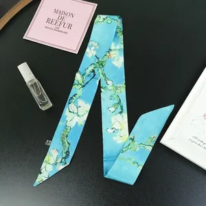 Macro detail of Van Gogh Almond Blossom silk twilly scarf for handbag handle decoration