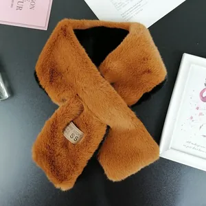 Close-up of ginger brown faux rabbit fur scarf with soft texture and crossover design
