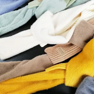 Soft faux rabbit fur knitted scarf for women in vibrant colors with a leather patch detail