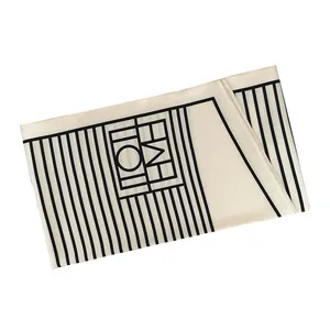 Elegant off-white narrow silk scarf with minimalist black stripes and geometric patterns