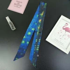 Macro view of starry night oil painting print on narrow silk scarf tied around a handle