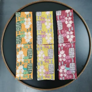 Three elegant narrow silk scarves with forest motifs in orange, yellow and dark red