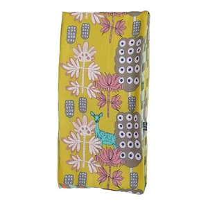 Ginger yellow long silk scarf featuring pink floral and reindeer prints on white background
