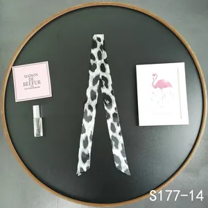 Close-up of black and white leopard print silk scarf twilly for handbag handle