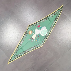 Diamond-shaped green silk scarf featuring cartoon mouse and LOVE print on a gray background