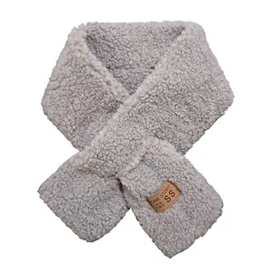 Thick warm light grey faux lamb wool scarf with crossover design and leather tag