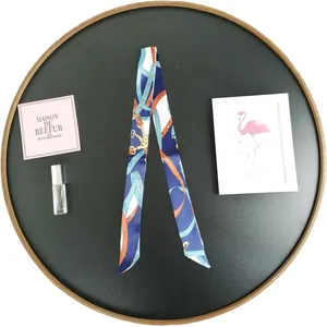 Elegant skinny scarf with chain pattern on black tray for luxury bag decoration