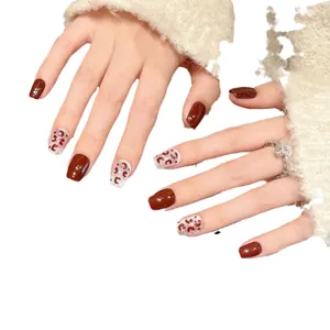 Handmade burgundy cat-eye press-on nails with leopard patterns and glitter finish