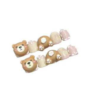 Handmade 3D cartoon bear press-on nails for kids with pink gradient and polka dot patterns