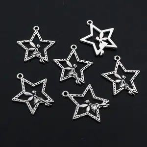 Macro detail of six antique silver alloy star fairy charms for DIY jewelry crafting