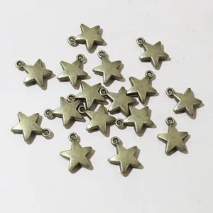Detailed macro shot of vintage bronze star-shaped alloy charms for DIY jewelry making