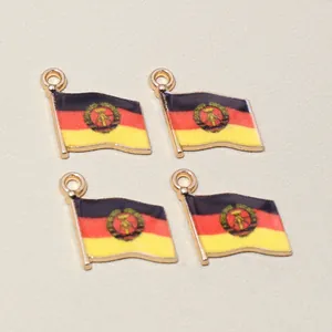 Macro detail of alloy enamel East Germany flag charms for DIY jewelry making 16x14mm