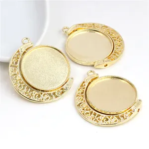 Detailed view of three golden rotating 25mm pendant trays with hollow moon frames for DIY