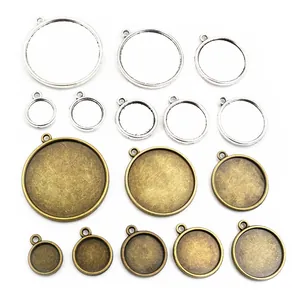 Macro detail of various round alloy pendant bezel settings for DIY jewelry making