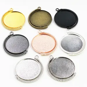 Rotating round alloy pendant trays in 8 metallic finishes with beaded edges for DIY jewelry