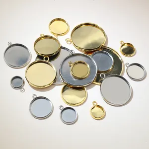 Various sizes of round stainless steel pendant trays in gold and silver finishes