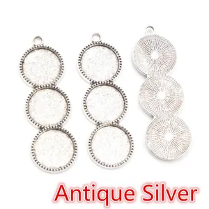 Detailed view of antique silver triple round bezel pendants with knurled texture
