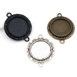 Round 20mm alloy pendant trays with floral patterns in bronze, silver, and black