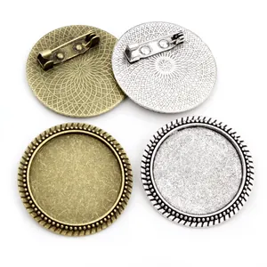 Detailed view of 25mm round brooch pin trays in antique bronze and silver finishes