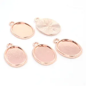 Five rose gold oval alloy pendant bases with internal 13x18mm tray and radial texture