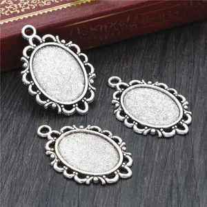 Three antique silver oval alloy pendant bases with lace edges for DIY jewelry making