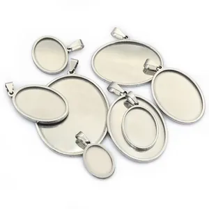 Oval stainless steel pendant trays for DIY jewelry making in various sizes on white background