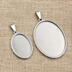 Macro view of oval stainless steel bezel trays for DIY jewelry making in two sizes