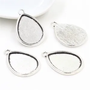 Silver teardrop alloy pendant base for DIY jewelry making with textured back