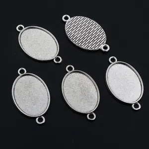 Supports pendentifs ovales argentés à double trou pour bijoux DIY avec texture au dos