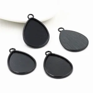 Set of four matte black teardrop alloy pendant trays for DIY jewelry making accessories